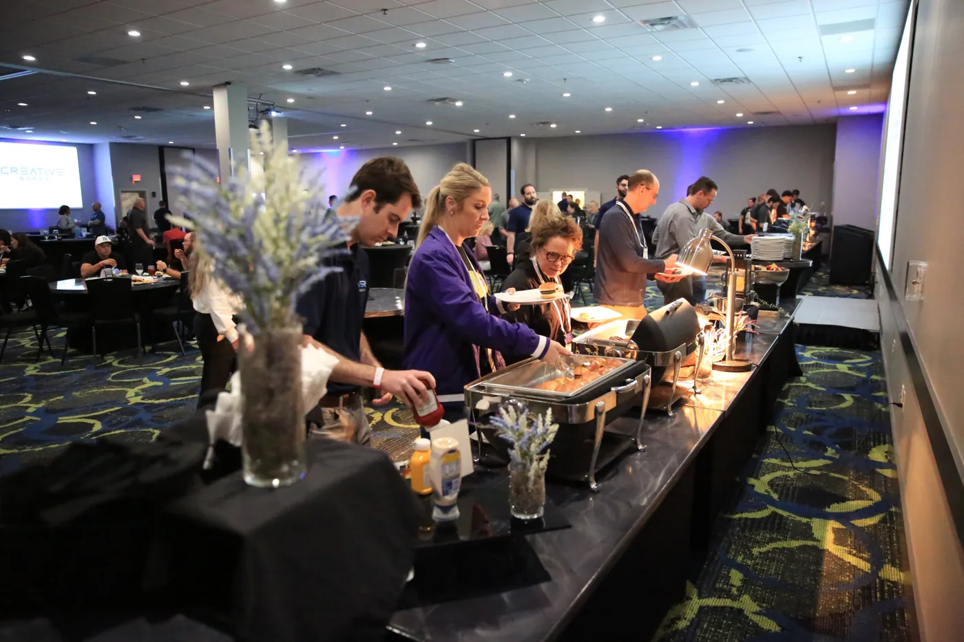 Guests moving through the buffet line at The Big Show Wrap-Up